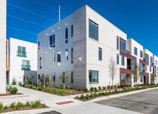 a large white building with a street in front of it at Marcato, Missouri