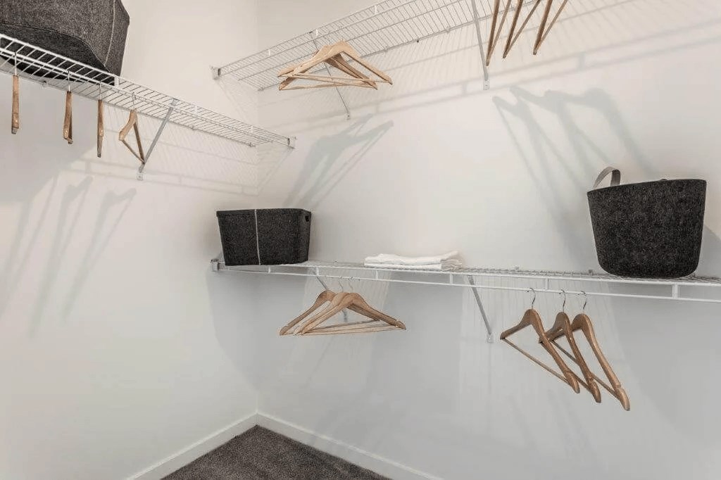 a walk in closet with baskets and shelves at Marcato, Kansas City, 64108