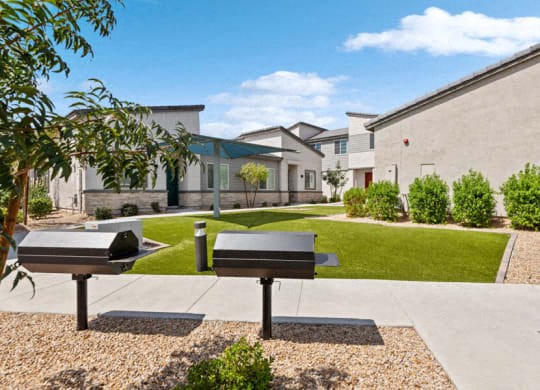 two ping pong tables in front of a house