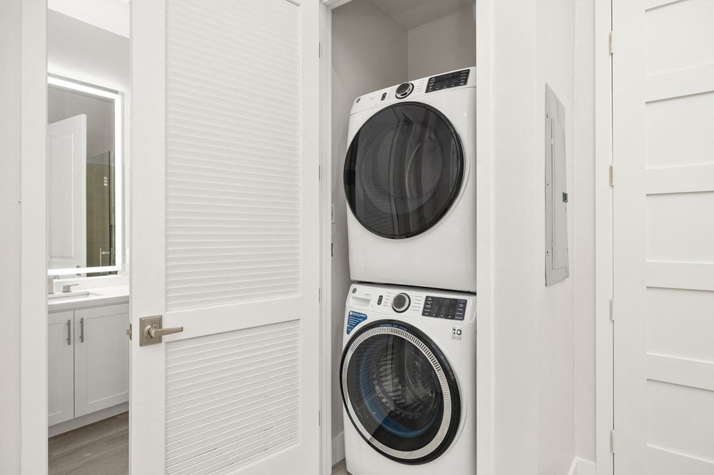 a white washer and dryer in a laundry room