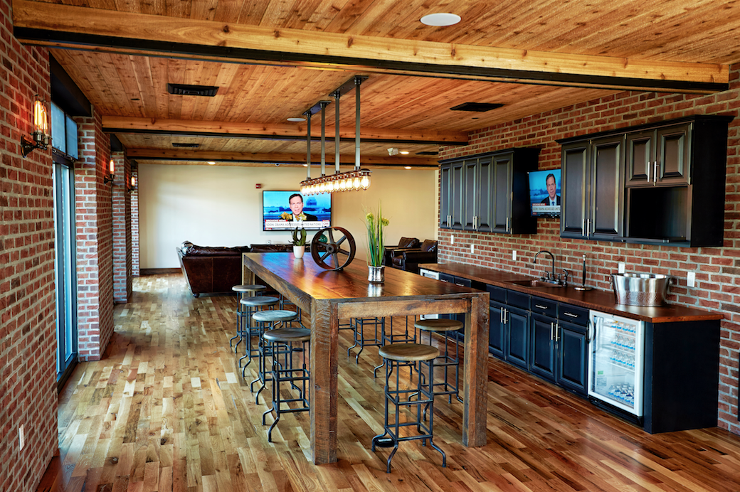 a kitchen and dining room with a wooden table