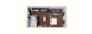 A top down view of a living room with a couch, coffee table, and kitchen area.