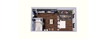 A top down view of a living room with a couch, coffee table, and kitchen area.