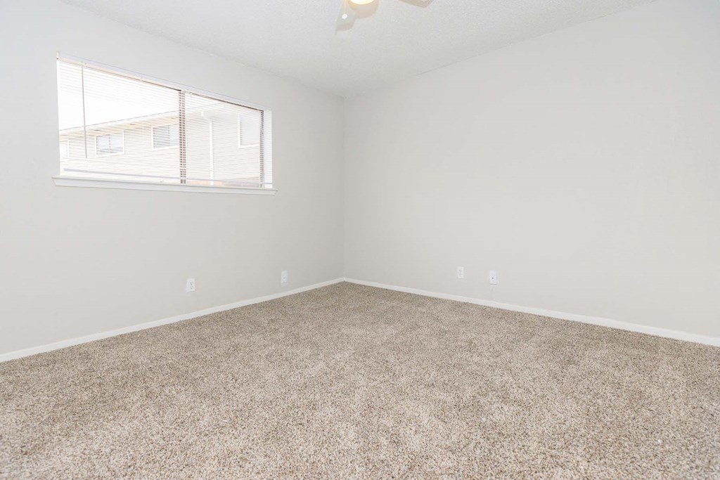 Carpeted Bedroom at Castlewood Apartments, Texas