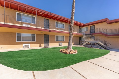 Courtyard with artificial turf and palm tree at Oakridge Apartments, California, 94509