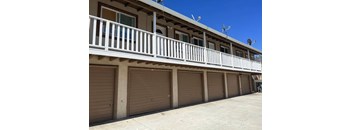 a row of garage doors on the side of a building