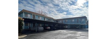 a building with cars parked in front of it