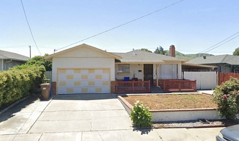 a house with a driveway and a garage door