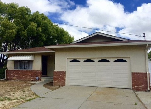 a white house with a white garage door