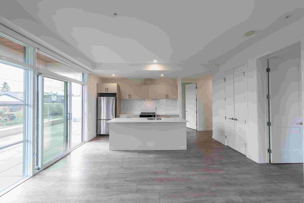 A modern kitchen with a large island in the middle.