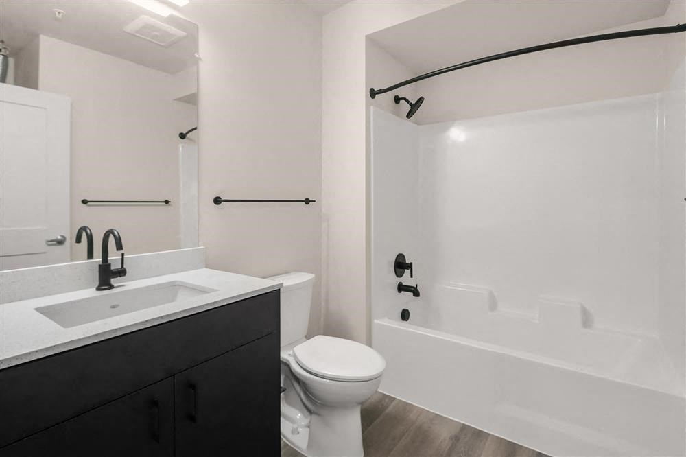 a bathroom with a sink toilet and a bath tub