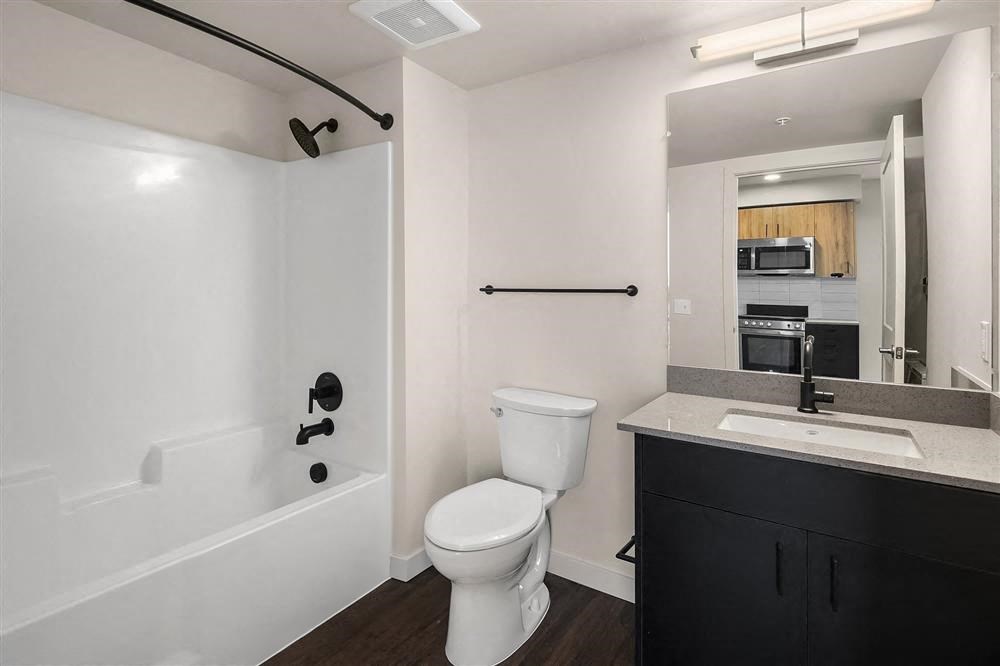 a bathroom with a white toilet and a sink