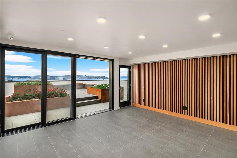 a living room with sliding glass doors and a balcony