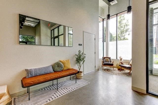 a living room with a couch and a mirror