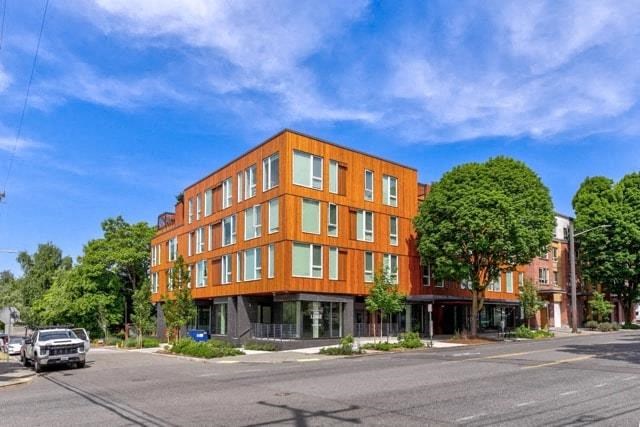 a large orange building on the corner of a street