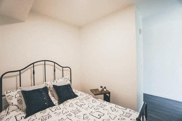 a bedroom with a bed with pillows on it