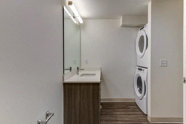 a bathroom with a washing machine and a sink and a mirror