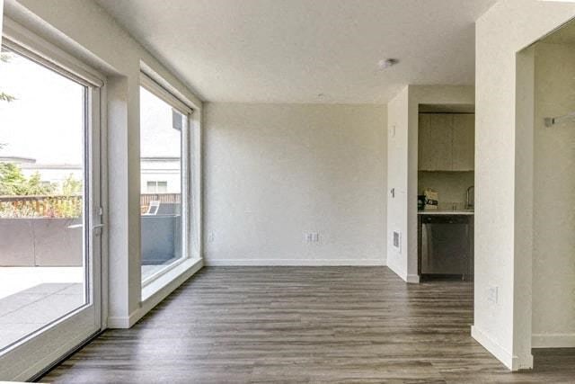 an empty living room with a large window