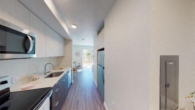 a kitchen with a sink and a microwave