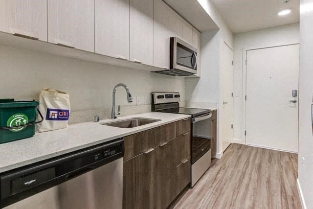a kitchen with a sink and a microwave