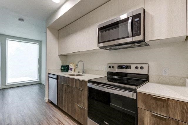 a kitchen with a stove and a microwave