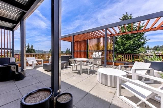 a patio with tables and chairs on a balcony