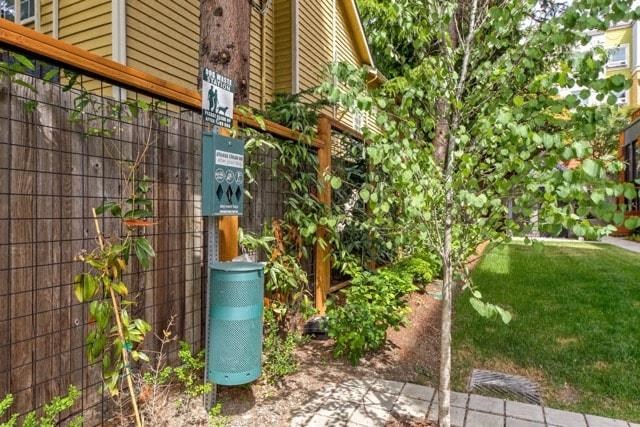 a gas pump on a pole in front of a house