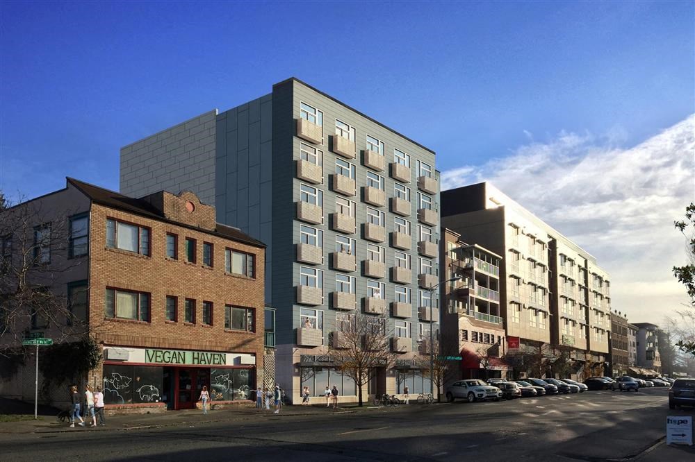 a tall building on the corner of a city street