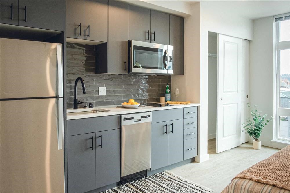 a small kitchen with a sink and a microwave