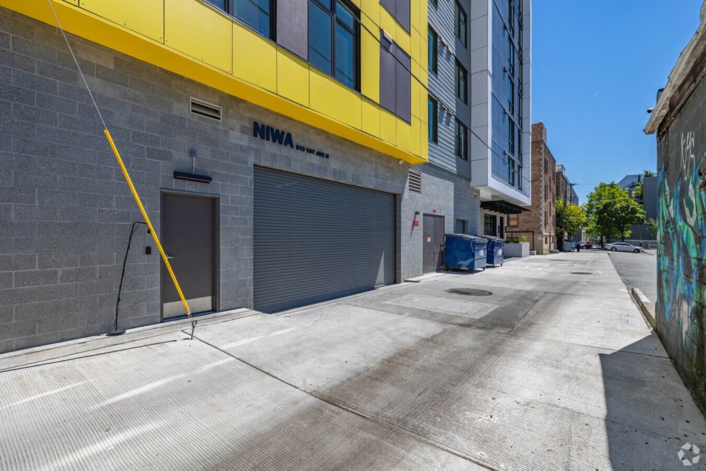 a garage door on the side of a building on a city street