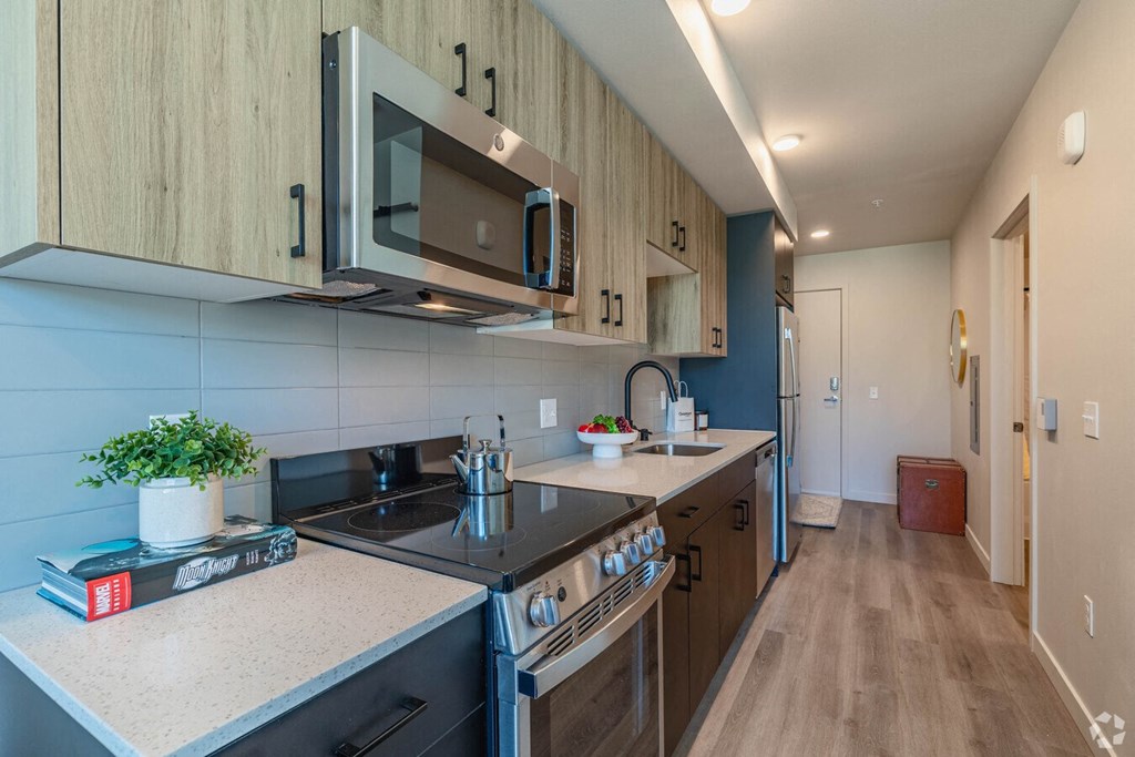 a kitchen with a stove and a microwave