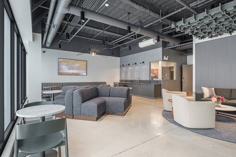 A modern office space with a grey and white color scheme.