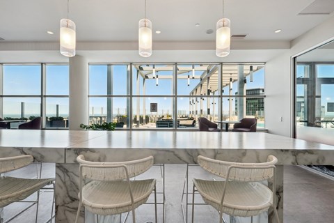 A modern dining area with marble tables and chairs.