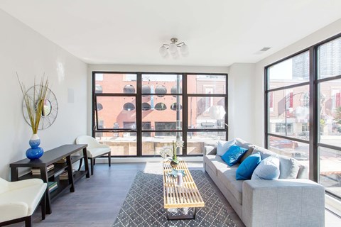 a living room with a couch and a large window