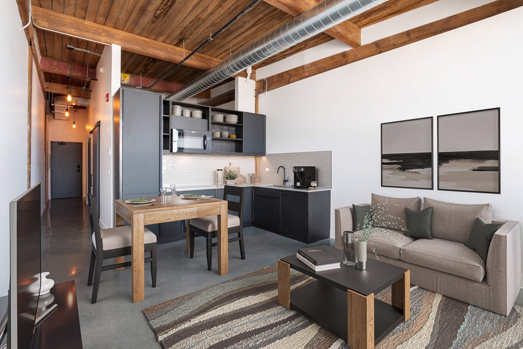 a living room and kitchen in a loft