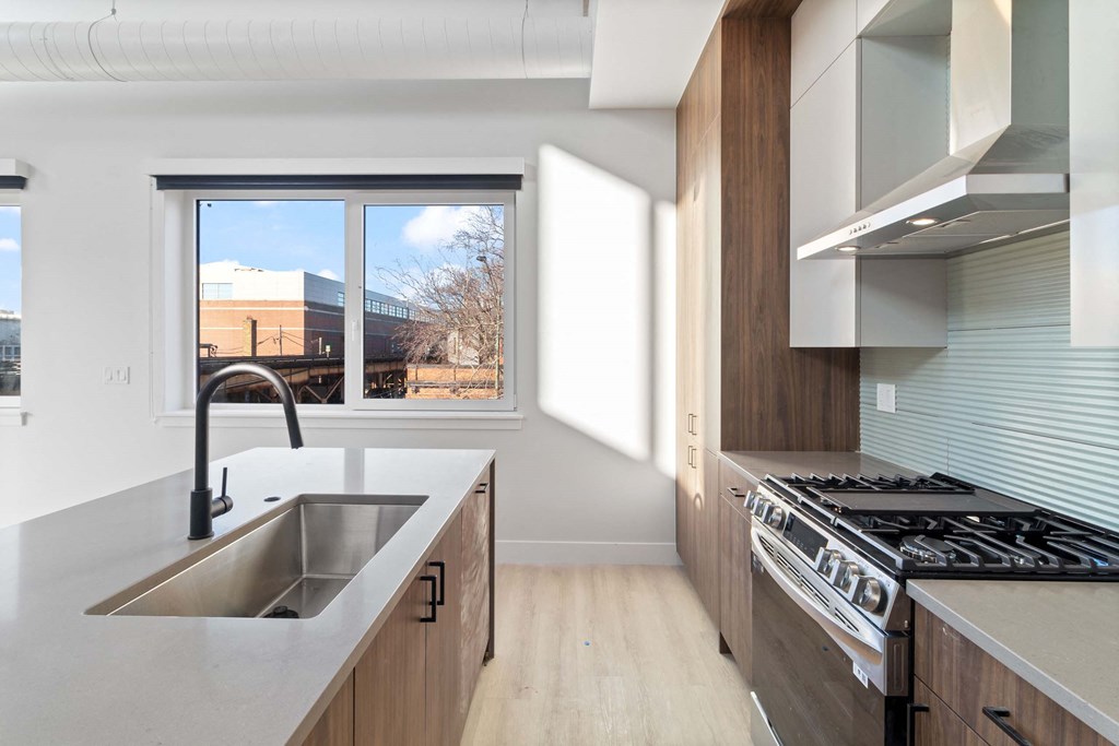 a kitchen with a sink and a window
