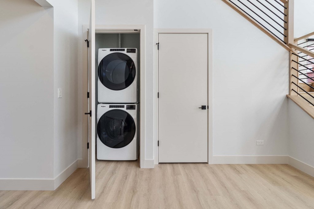 a washer and dryer in a room next to a door