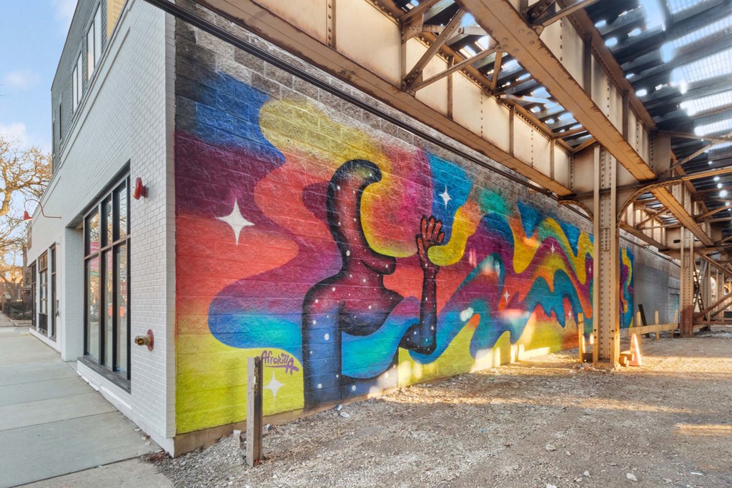a mural of a guitar on the side of a building
