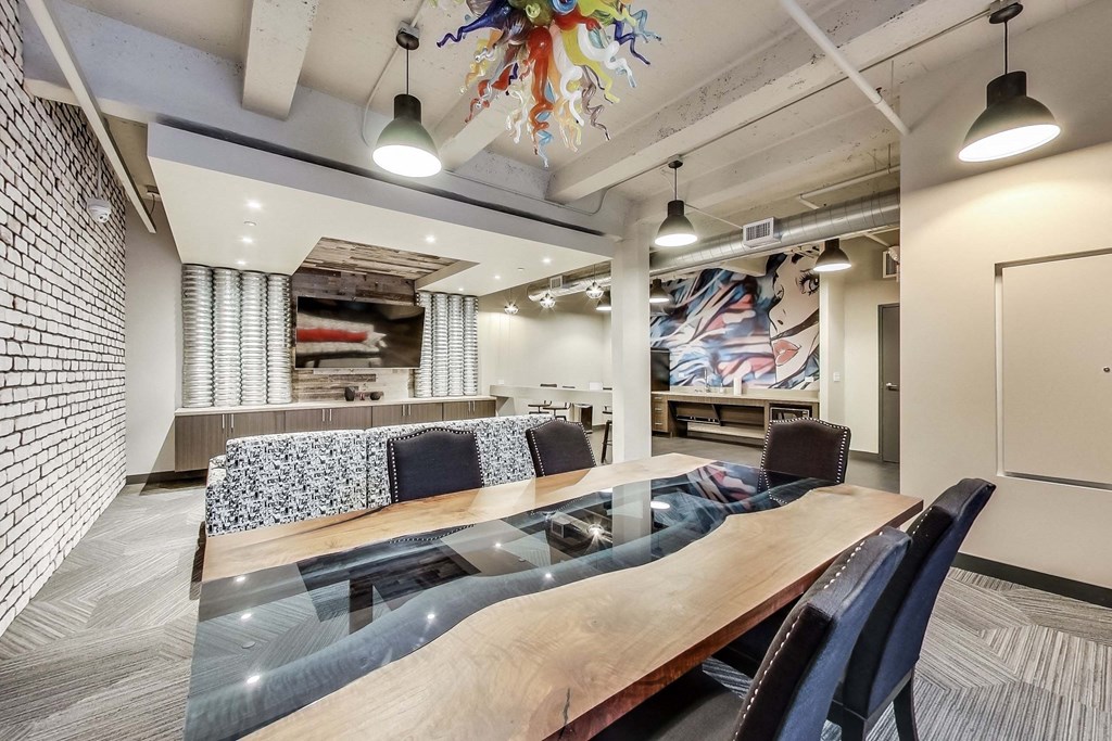 a conference room with a wooden table and chairs