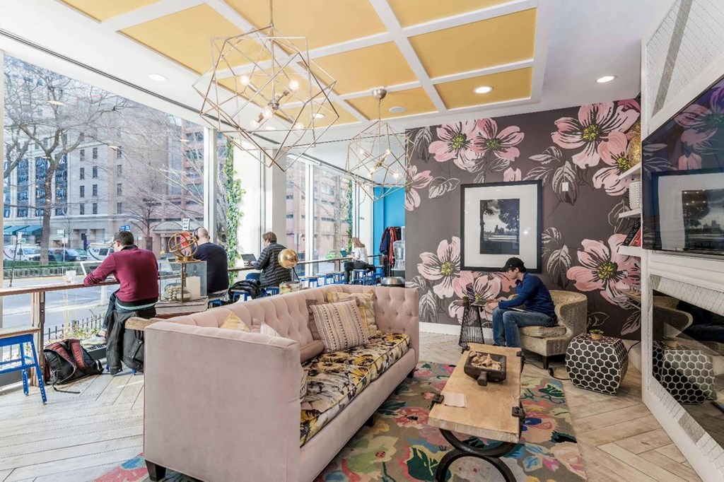 a living room with a couch and a large window