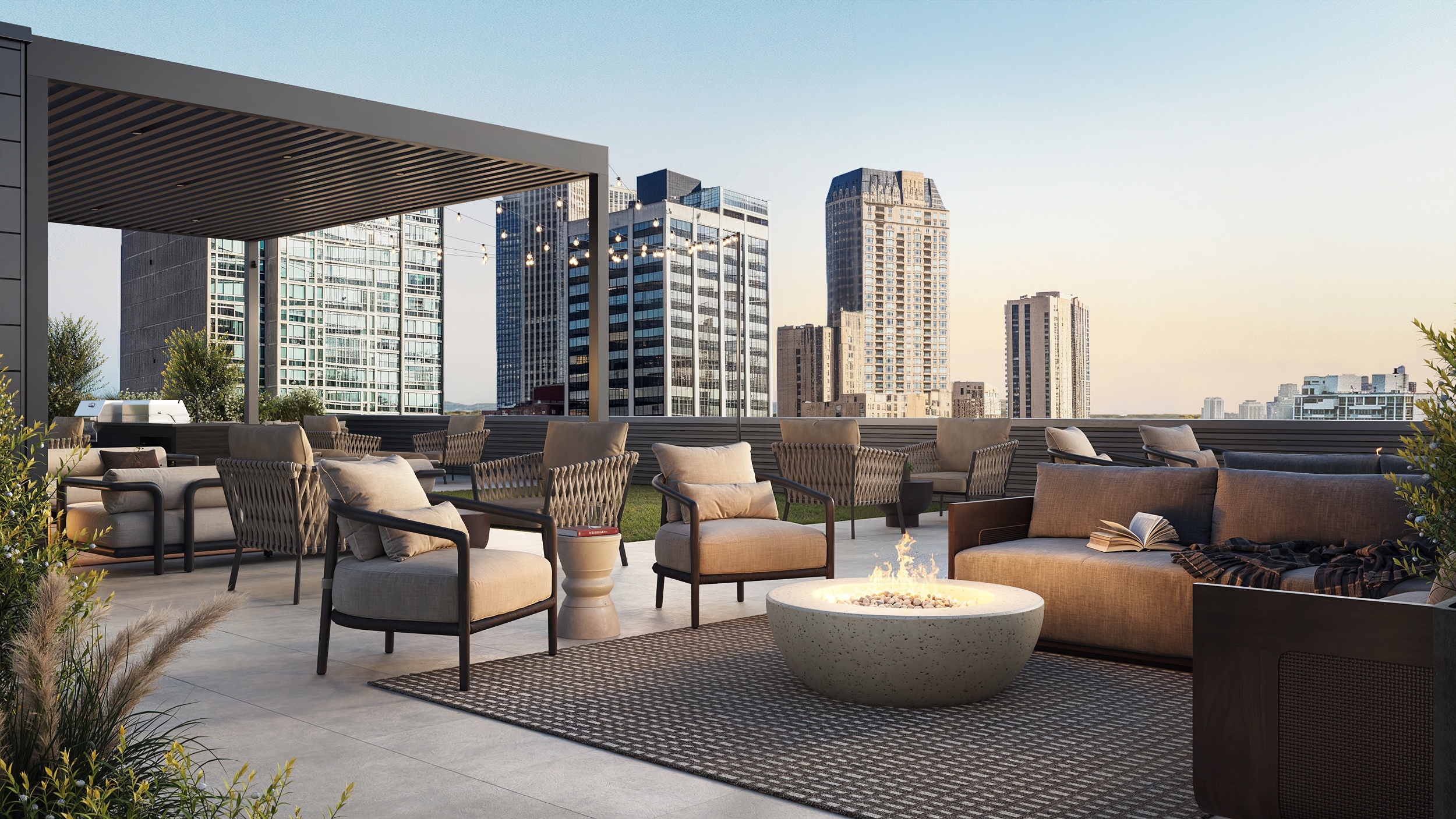 A patio with a fire pit and chairs overlooking a city skyline.