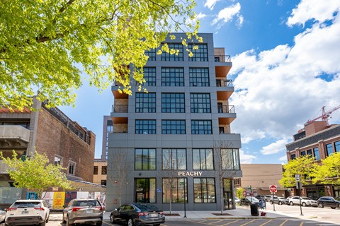 A modern building with the word "Peachy" on the front.