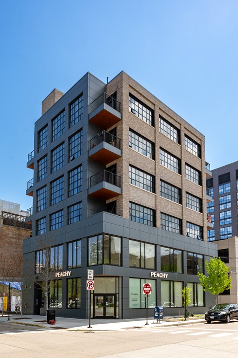 A modern building with the word "Peachy" on the front.