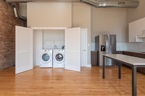 A laundry room with a washer and dryer in it.