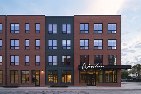 A Westline building with a red brick facade and a black section in the middle.