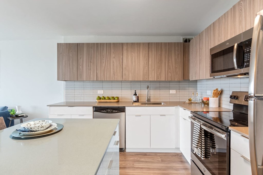 a kitchen with a counter top and a stove