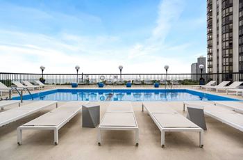 Outdoor pool with lounge chairs
