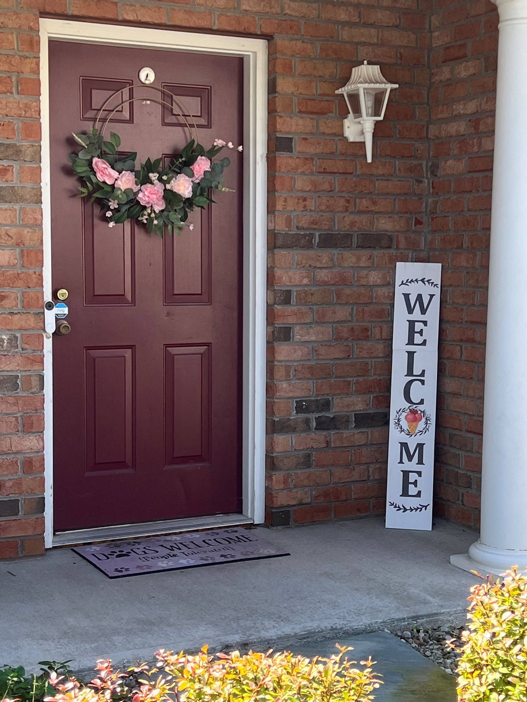 View of covered front porch entrance door