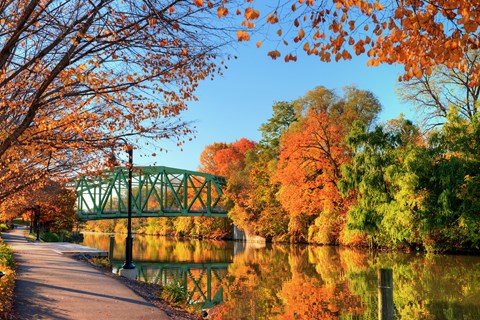 Image of a canal bridge and fall leaves by the Erie Canal in Pittsford NY near Westport Crossing