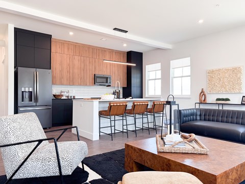 A modern kitchen with a black and white chair.